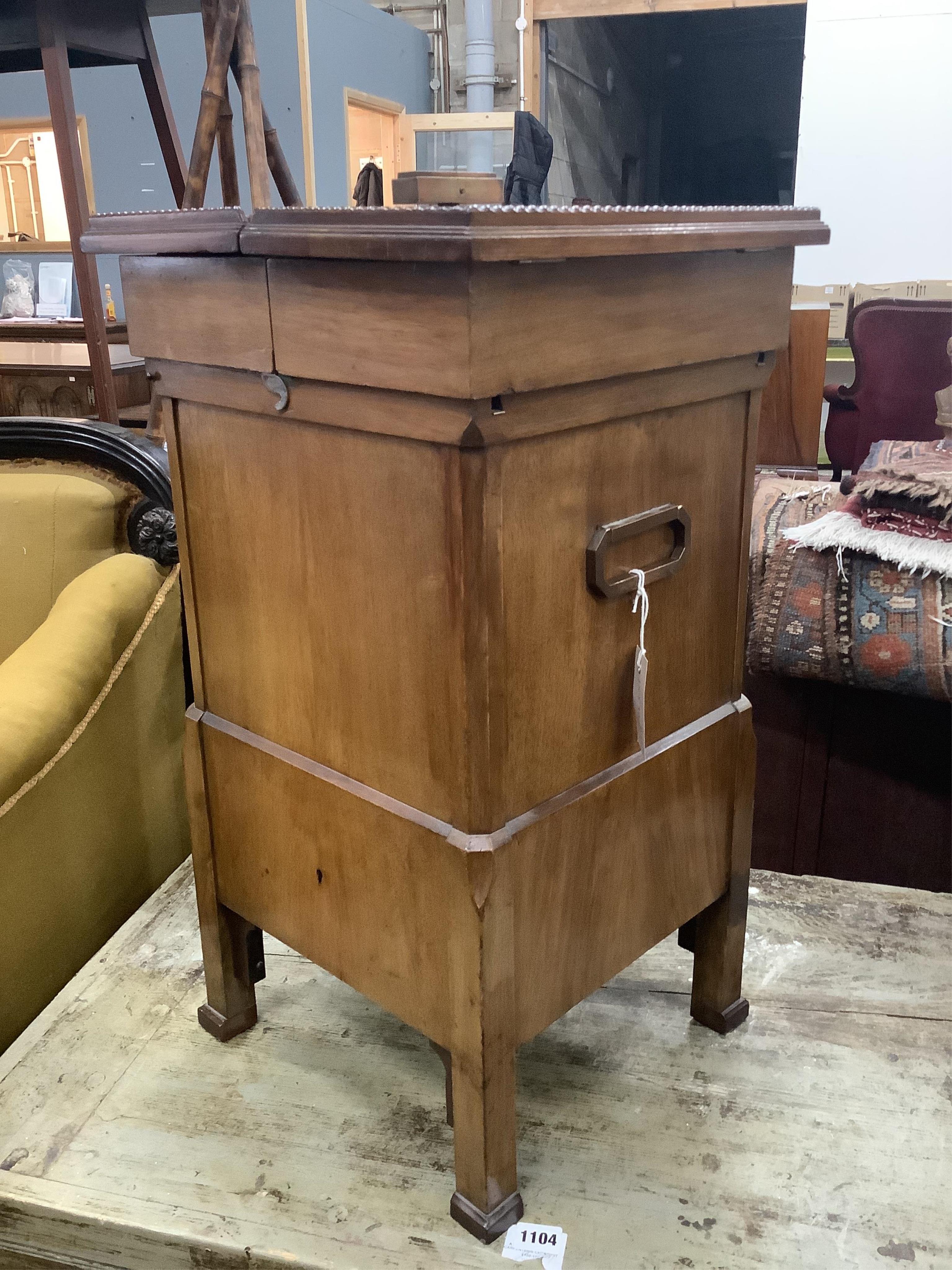 An early 20th century brass mounted mahogany 'Surprise' patent drink's cabinet, retailed by Goldsmiths & Silversmiths Co., width 37cm, depth 36cm, height 68cm. Condition - good